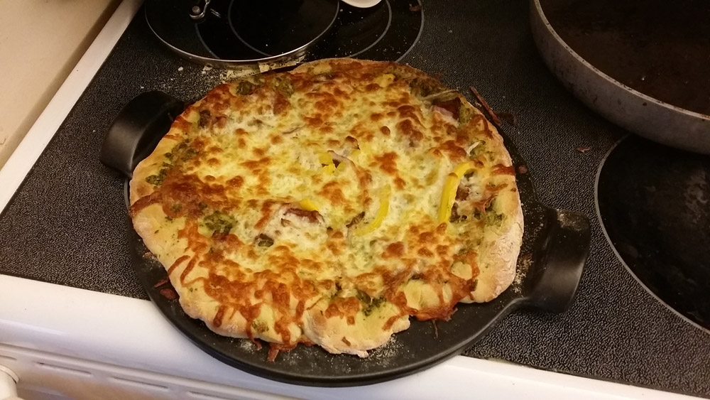 This one was mine. Delicious basil pesto for the sauce, stacks of veg, lots of mozarella and parm. 